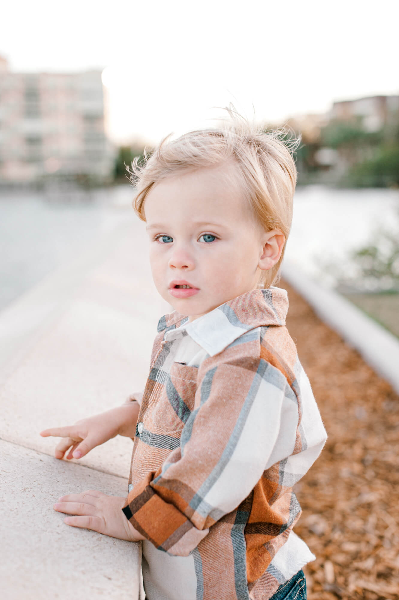 Adorable closeup of a toddler in a flannel near Coral Reef Academy during his family photo session.