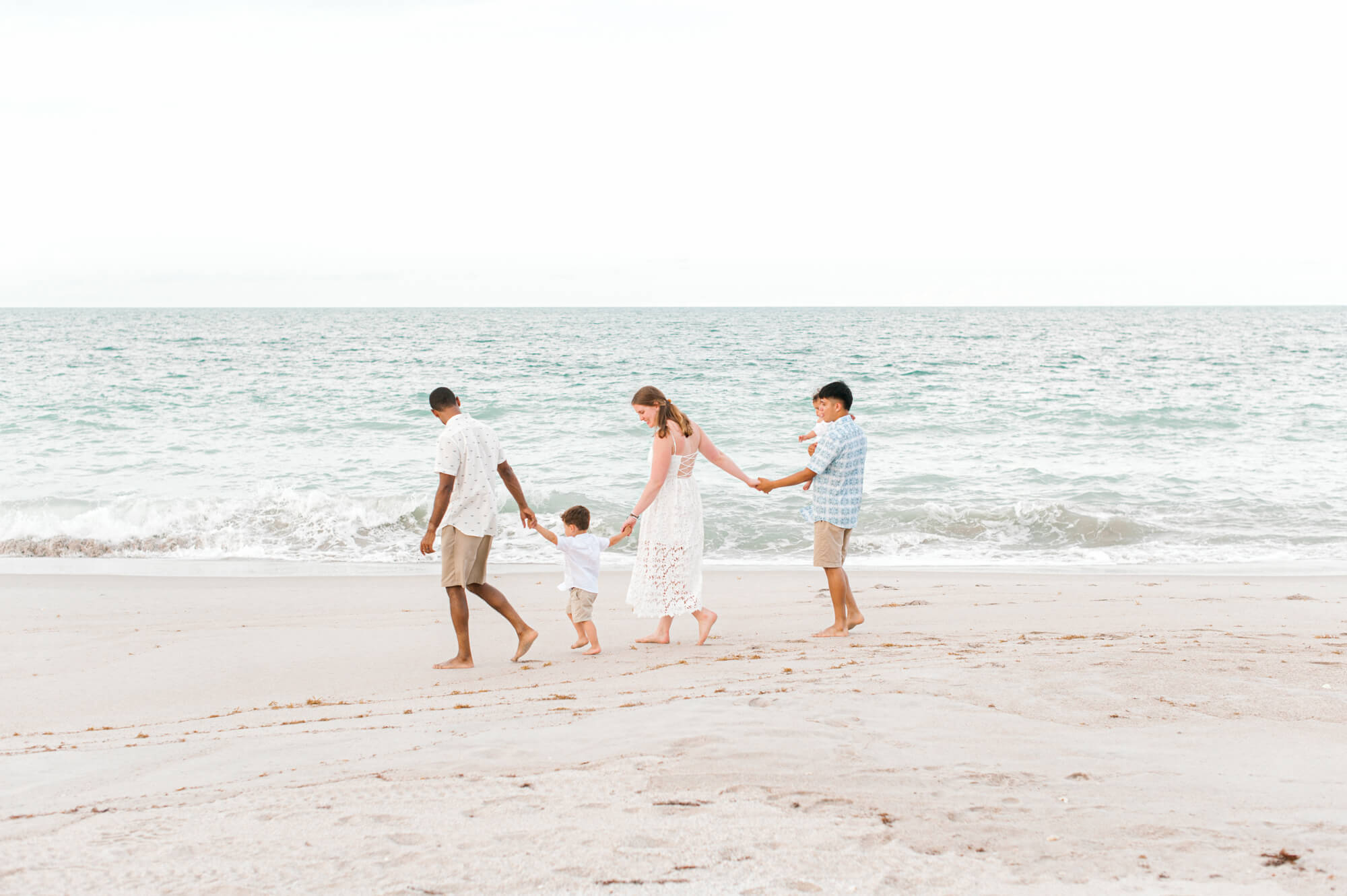 Stroller rentals in Orlando would be perfect for this stunning family walking along the coast of Vero Beach, Florida.
