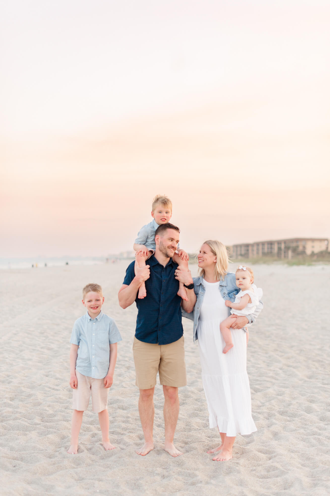 Family of five walking along the beach at sunset Viera Pediatric Dentistry